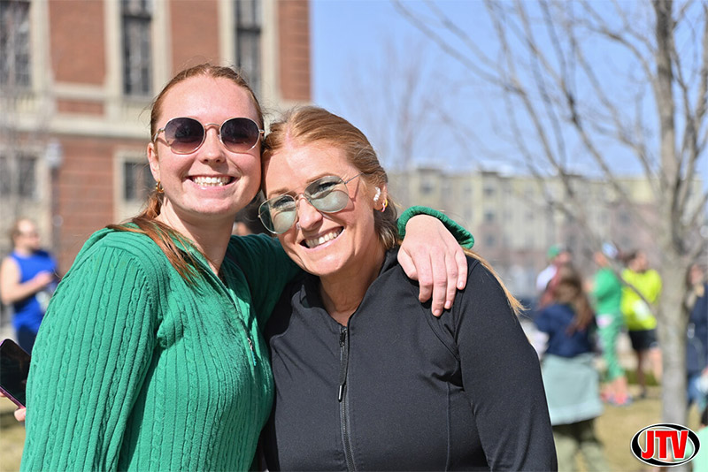 two women posing before the shamrock shuffle